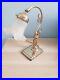 Lampe art déco femme en bronze doré et tulipe blanche verre opaque